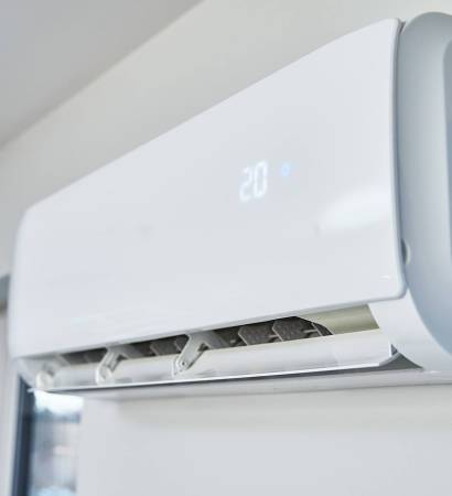 Adjusting temperature on air conditioner, Working air conditioner for comfort temperature in home at hot summer, cooling air in the room